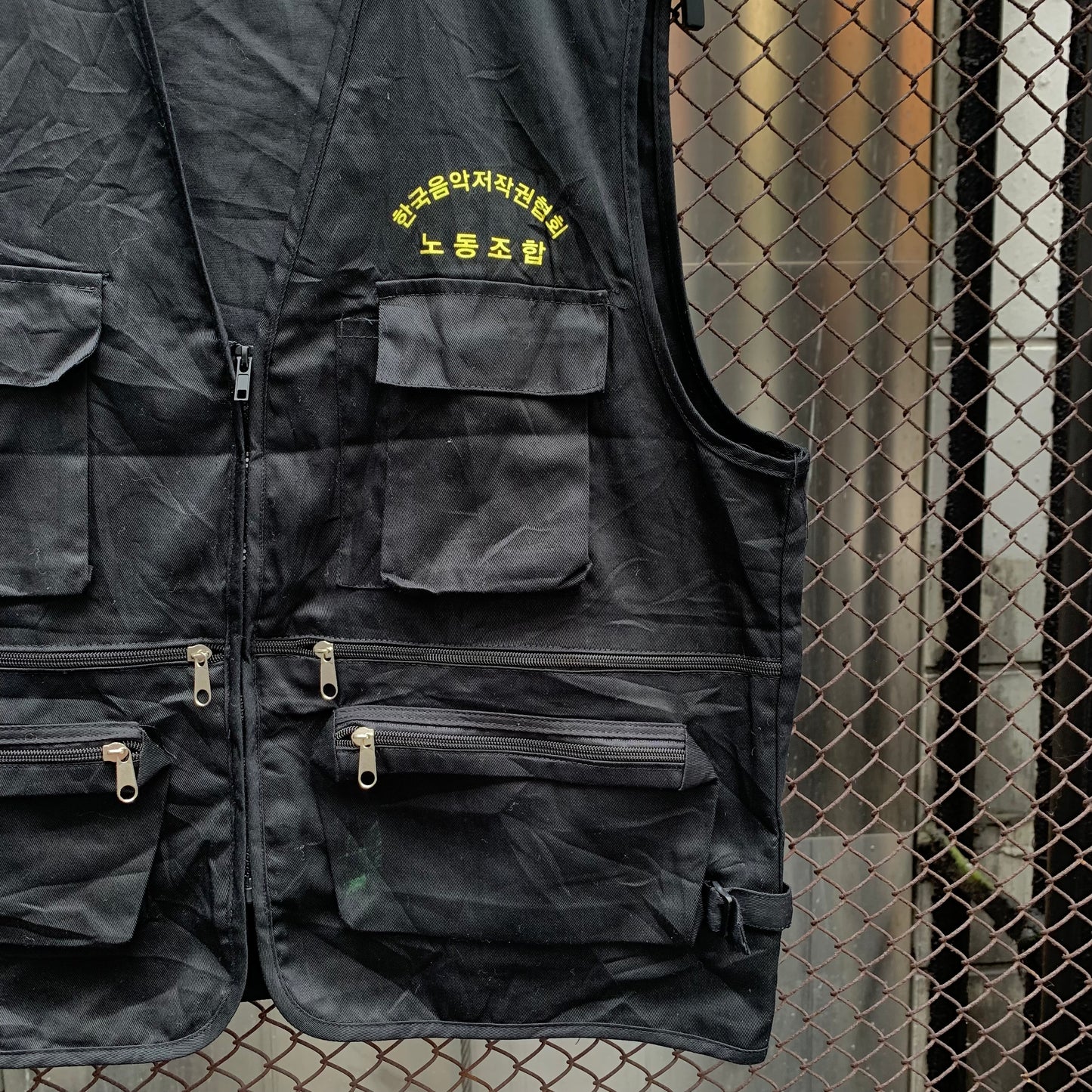Korean Vest - Black. Yellow writting